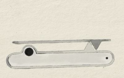 The spring clip in articulation: a single sprung leaf, hinged at one end, lifting away from the body to admit fabric.